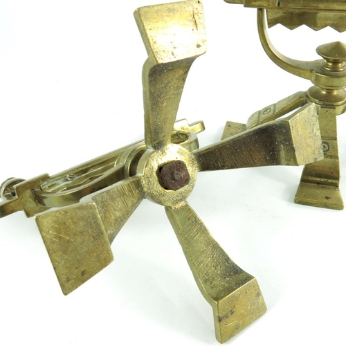 613 - A pair of Aesthetic Movement brass andirons, in the style of Christopher Dresser, circa 1880, each o... 