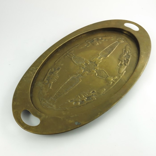 621 - Margaret Gilmour (attributed), a Glasgow School Arts and Crafts brass tray, oval form, repousse deco... 