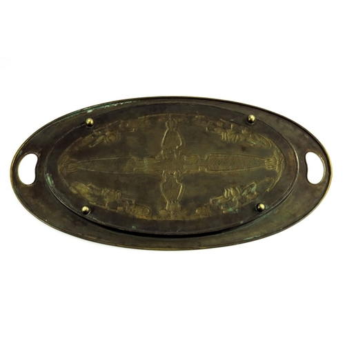 621 - Margaret Gilmour (attributed), a Glasgow School Arts and Crafts brass tray, oval form, repousse deco... 