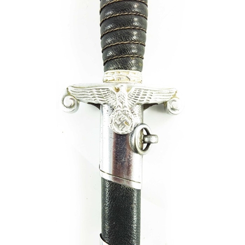 634 - World War Two German Land Customs Officer's dress dagger, housed in dark green leather scabbard with... 