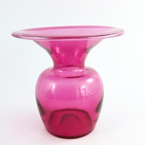 671 - A Victorian cranberry glass spittoon, with wide flared and folded rim