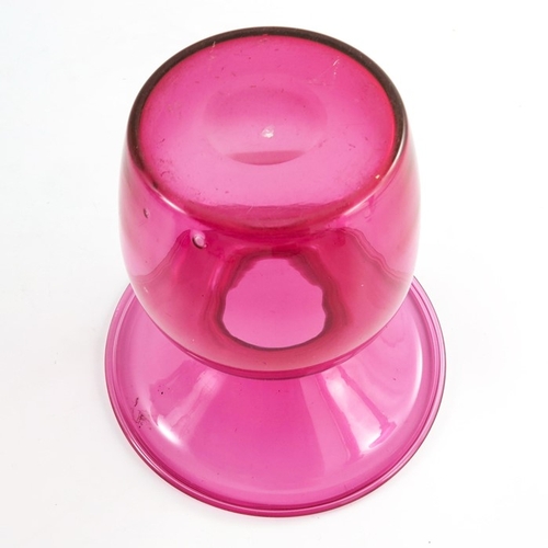 671 - A Victorian cranberry glass spittoon, with wide flared and folded rim