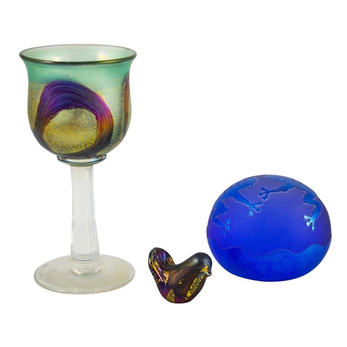 693 - An Isle of Wight iridescent studio glass goblet or wine glass, together with a miniature bird sculpt... 