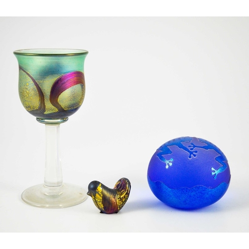 693 - An Isle of Wight iridescent studio glass goblet or wine glass, together with a miniature bird sculpt... 