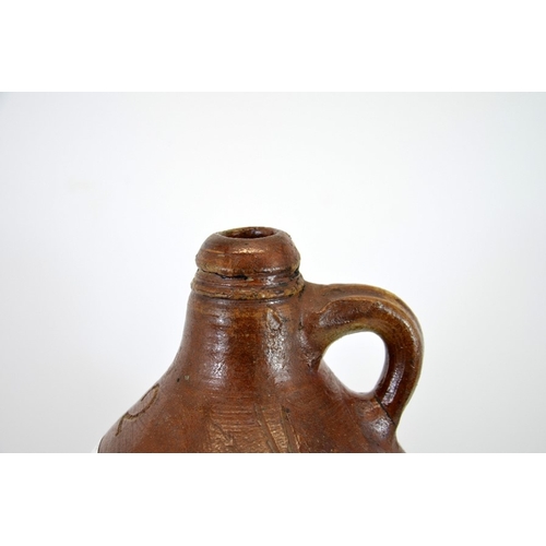 768 - An 18th century salt glazed stoneware flagon, ovoid Bartmankrug form, incised 2 for two gallon and V... 