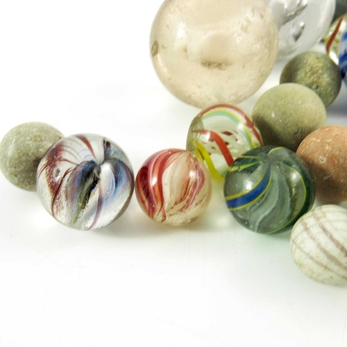 784 - A box containing four Sulphide and other Victorian glass and stone marbles, 12mm to 44 mm