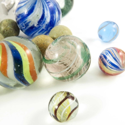 784 - A box containing four Sulphide and other Victorian glass and stone marbles, 12mm to 44 mm