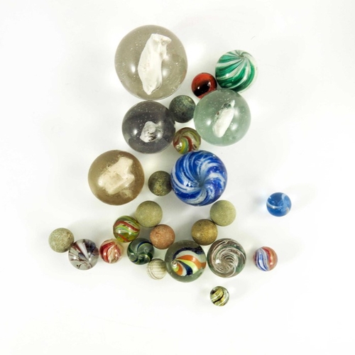 784 - A box containing four Sulphide and other Victorian glass and stone marbles, 12mm to 44 mm