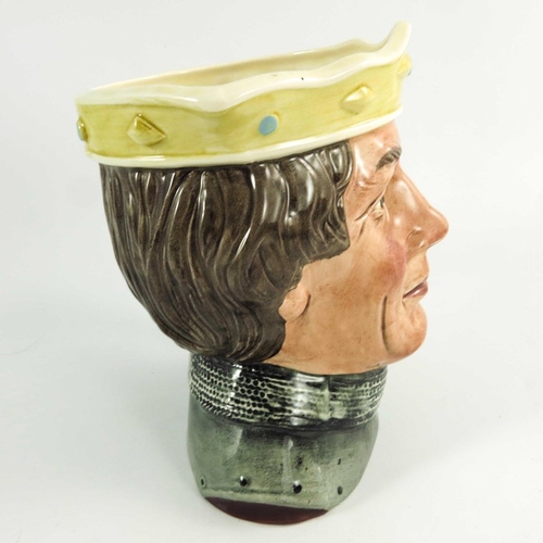 846 - A Royal Doulton large character jug, Henry V, flag and crown painted in a colourway, 19cm high