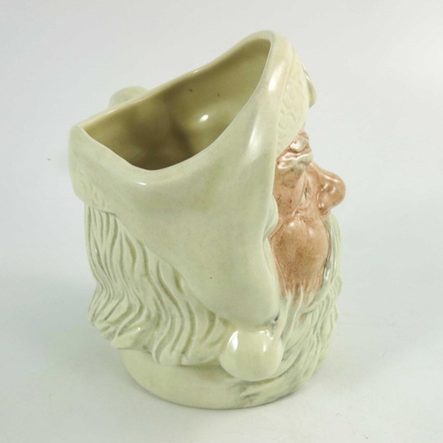 848 - A Royal Doulton small character jug, Santa Claus, with a white handle, 11cm high