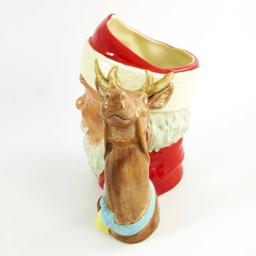 851 - A group of three Royal Doulton large character jugs, Santa claus, 18cm high (3)