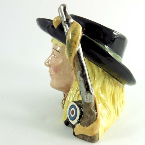 871 - A Royal Doulton medium character jug, Annie Oakley, silver and gold highlights colourway, Property o... 