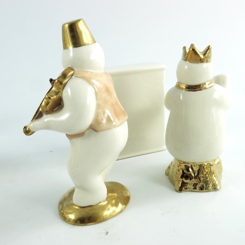 896 - Two Royal Doulton snowmen figures, Piano and Pianist and Violinist, gold and silver highlights colou... 