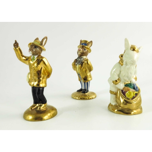 906 - A group of Three Royal Doulton Bunnykins, Uncle Sam, Santa and another all prototype with gold highl... 