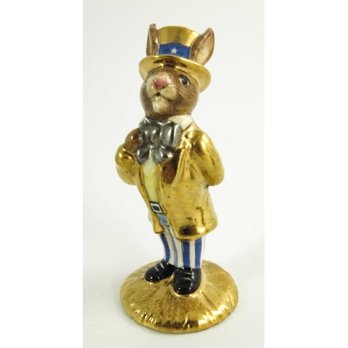 906 - A group of Three Royal Doulton Bunnykins, Uncle Sam, Santa and another all prototype with gold highl... 