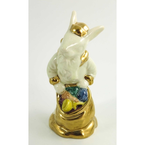 906 - A group of Three Royal Doulton Bunnykins, Uncle Sam, Santa and another all prototype with gold highl... 