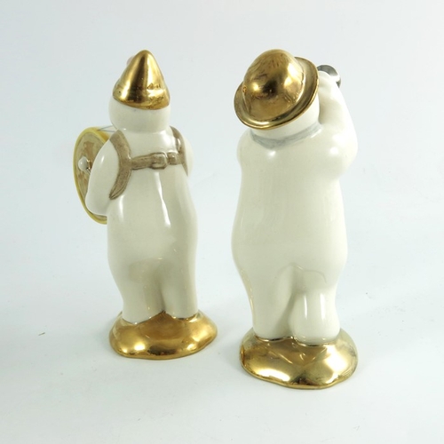 919 - Two Royal Doulton snowmen figures, Bass Drummer and Trumpeter, gold and silver highlights colourway,... 