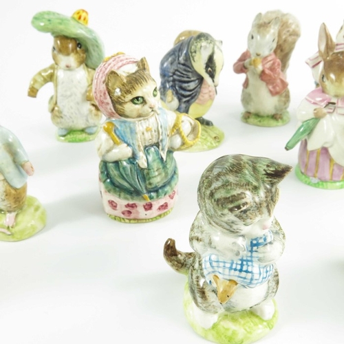 936 - A group of fourteen Beswick Beatrix Potter figures, gold backstamps, printed marks (14)