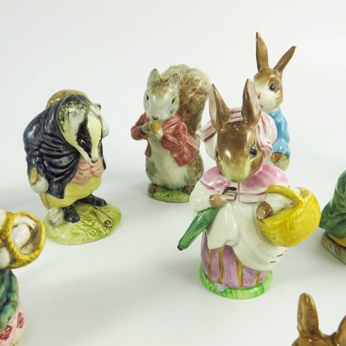 936 - A group of fourteen Beswick Beatrix Potter figures, gold backstamps, printed marks (14)