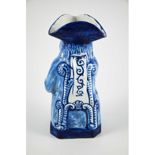 951 - A Delft faience blue and white Toby jug, 23cm high