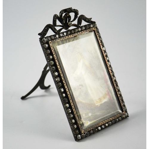 957 - A painted porcelain plaque of Ophelia, in a white metal and paste easel frame, 14cm high