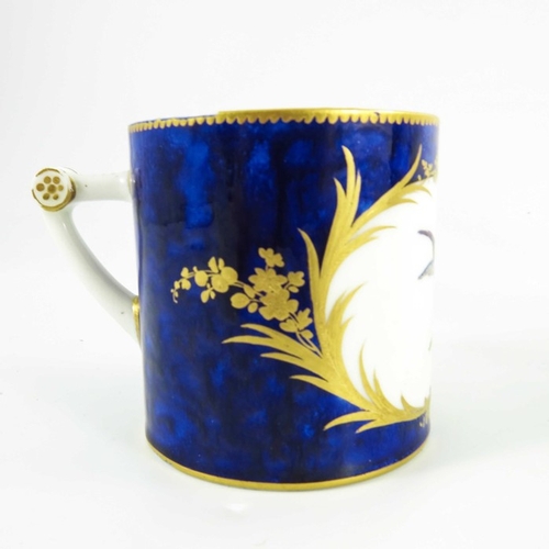 963 - A Sevres porcelain coffee can and saucer, circa 1800, painted with exotic  birds within gilt feather... 