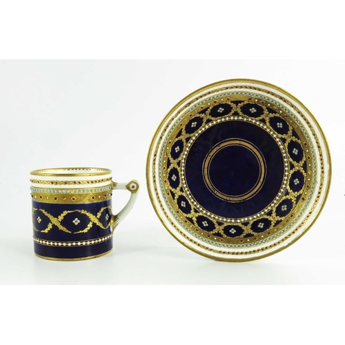 965 - A Sevres porcelain coffee can and saucer, circa 1800, later decorated with tooled gilt and jewelled ... 