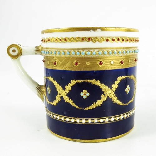 965 - A Sevres porcelain coffee can and saucer, circa 1800, later decorated with tooled gilt and jewelled ... 