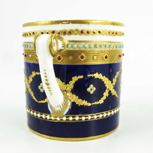 965 - A Sevres porcelain coffee can and saucer, circa 1800, later decorated with tooled gilt and jewelled ... 