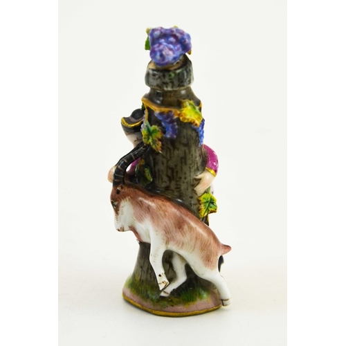 975 - A Meissen porcelain scent bottle, circa 1900, modelled as a boy and goat around a tree stump, the li... 