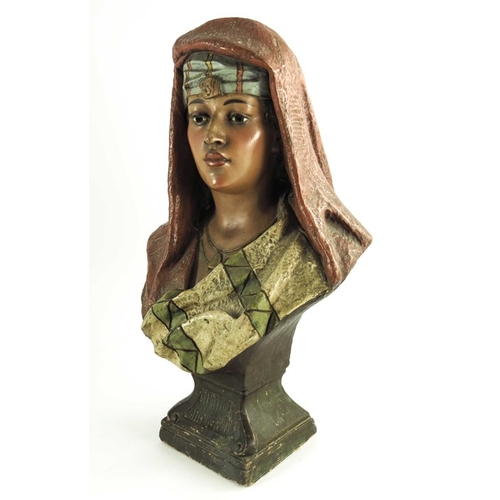 1001 - An Austrian painted plaster bust figure of an Arab woman, circa 1890, modelled in scarf, on plinth b... 