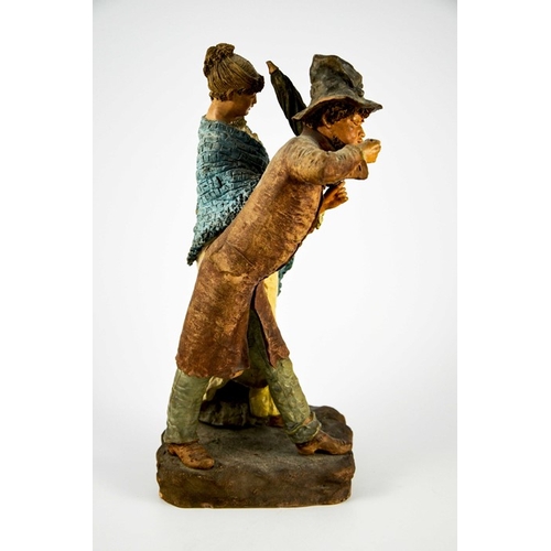 1003 - A Continental figure group of a man and woman with parasol and mandolin, 19th century, probably Germ... 