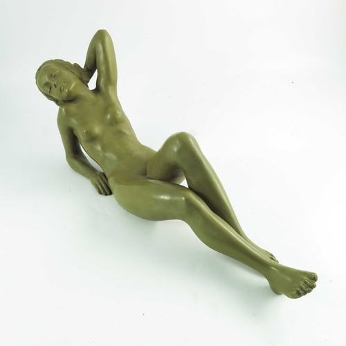 1029 - A Goldscheider figure Traumende, circa 1942, modeled as a reclining nude with an imitation patinated... 