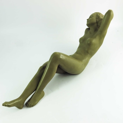 1029 - A Goldscheider figure Traumende, circa 1942, modeled as a reclining nude with an imitation patinated... 