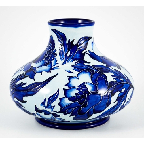 1041 - Philip Gibson for Moorcroft, a blue on blue Peony vase, 1999, squat bulboud form, impressed marks, 1... 