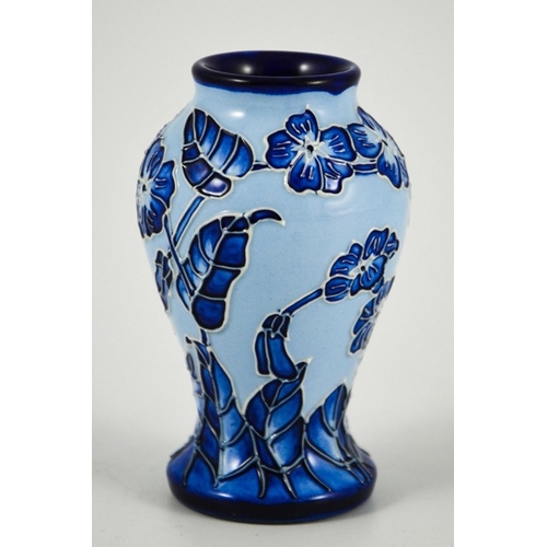 1055 - Carole Lovett for Moorcroft, a small Florian Echo vase, 2003, blue on blue, impressed marks, 10cm hi... 