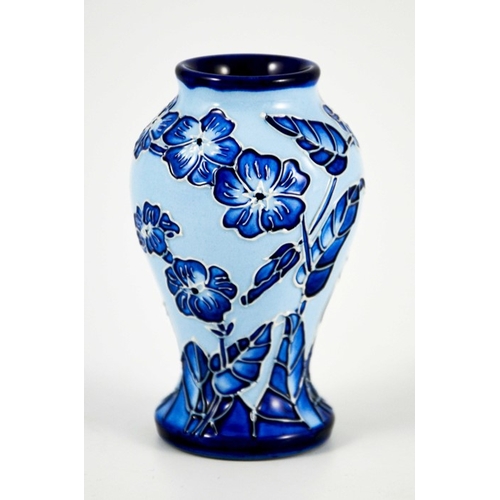 1055 - Carole Lovett for Moorcroft, a small Florian Echo vase, 2003, blue on blue, impressed marks, 10cm hi... 