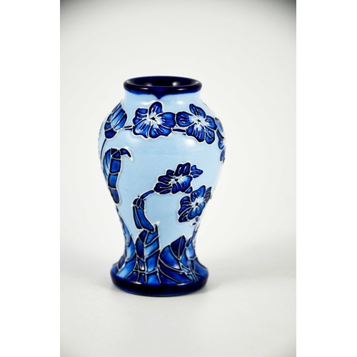 1055 - Carole Lovett for Moorcroft, a small Florian Echo vase, 2003, blue on blue, impressed marks, 10cm hi... 