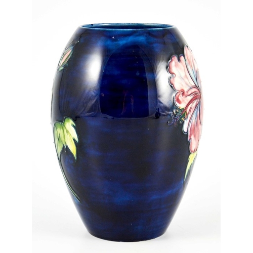 1081 - Walter Moorcroft, a Hibiscus vase, circa 1960s, ovoid form, blue ground, impressed marks and undergl... 