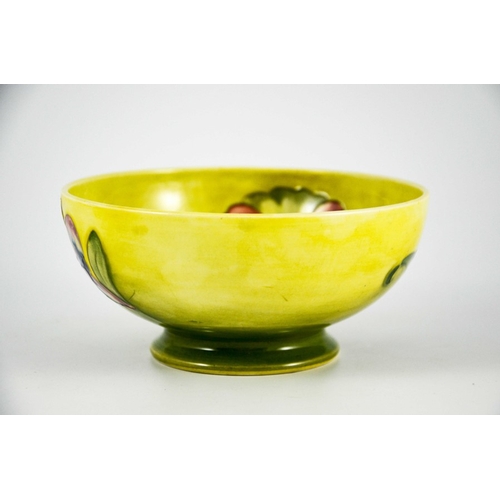 1086 - Walter Moorcroft, an Orchid bowl, circa 1950s, footed form, yellow draining to green, impressed mark... 