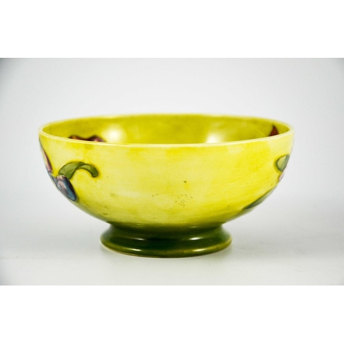 1086 - Walter Moorcroft, an Orchid bowl, circa 1950s, footed form, yellow draining to green, impressed mark... 