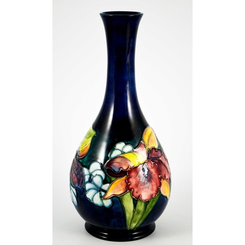 1088 - Walter Moorcroft, an Orchid vase, circa 1960, bottle form, impressed marks and underglaze teal monog... 