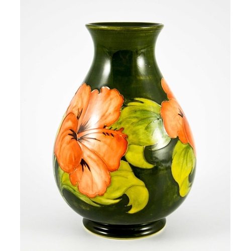 1090 - Walter Moorcroft, a Hibiscus vase, circa 1960s, baluster form, pink on green, impressed marks, under... 