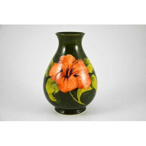 1090 - Walter Moorcroft, a Hibiscus vase, circa 1960s, baluster form, pink on green, impressed marks, under... 