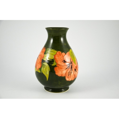 1090 - Walter Moorcroft, a Hibiscus vase, circa 1960s, baluster form, pink on green, impressed marks, under... 