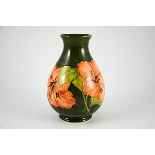 1090 - Walter Moorcroft, a Hibiscus vase, circa 1960s, baluster form, pink on green, impressed marks, under... 