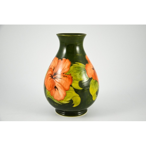 1090 - Walter Moorcroft, a Hibiscus vase, circa 1960s, baluster form, pink on green, impressed marks, under... 