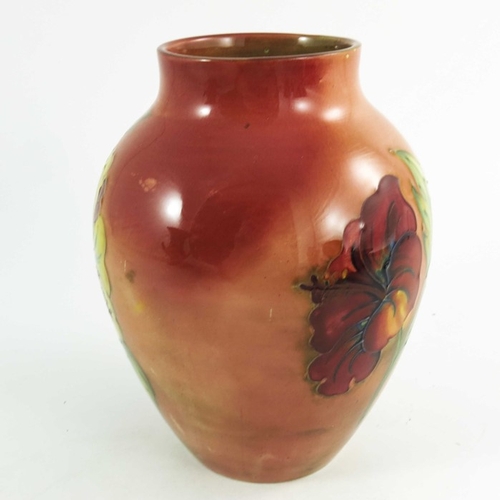 1091 - Walter Moorcroft, a flambe hibiscus vase, circa 1960, shouldered baluster form, impressed and painte... 