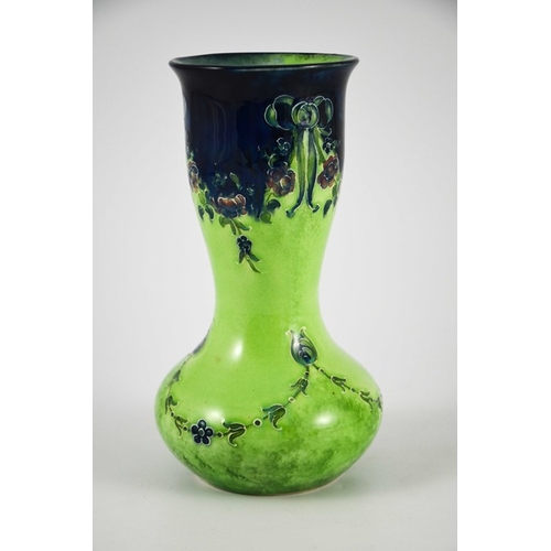 1102 - William Moorcroft for James MacIntyre, an Eighteenth Century on green vase, circa 1908, double gourd... 