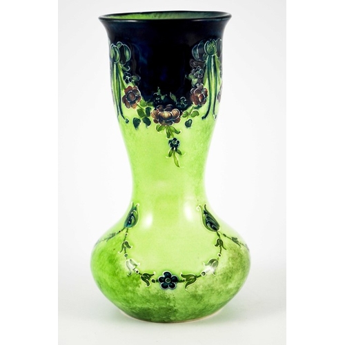 1102 - William Moorcroft for James MacIntyre, an Eighteenth Century on green vase, circa 1908, double gourd... 